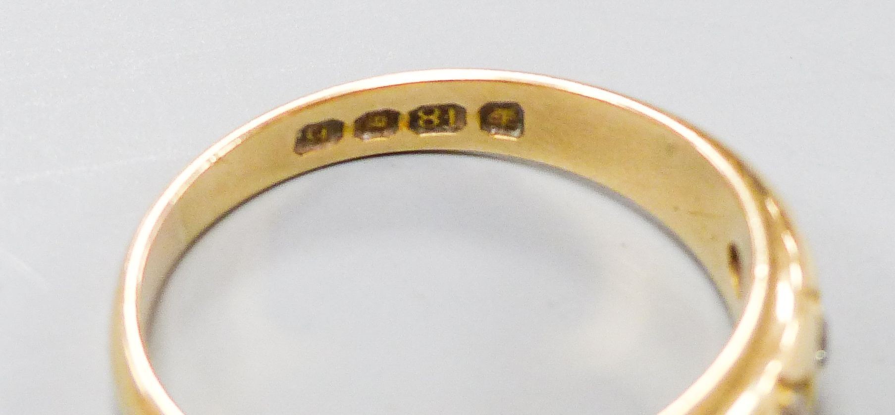 A late Victorian 18ct gold and graduated five stone gypsy set five stone ring, size Q, gross weight 5.5 grams.